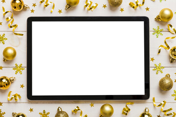 Christmas online shopping from home tablet pc with blank white display top view. Tablet with copy...