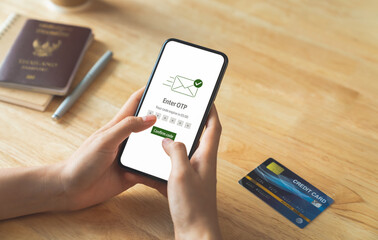 Hand using smartphone and mobile OTP secure verification on send to email with enter password for...