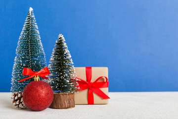 Christmas composition. craft Gift box, small tree, branches and craft DIY decorations on white background. New year concept. Christmas home decoration Flat lay, top view, copy space