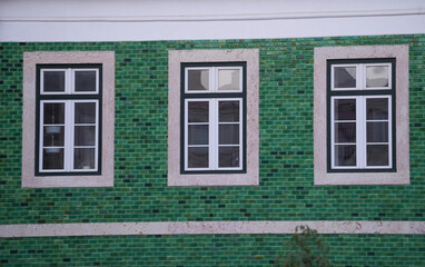 Fototapeta na wymiar the windows of a building. detail. the facade of a building photographed during the day.