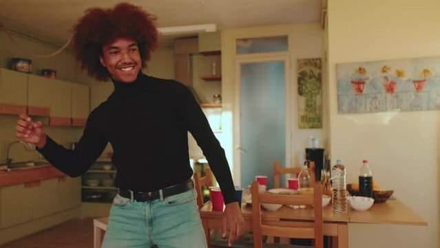 Happy man acting out word in the game of charades, gesturing and showing pantomime