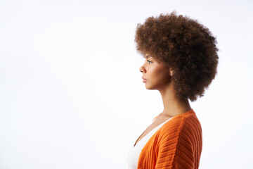 portrait of young latina woman with afro hair side view isolated on white background