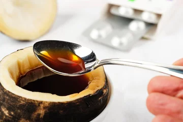 Fotobehang even children can take a teaspoon of black radish syrup with honey for colds and coughs © Alex