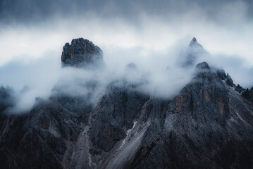 View of moody mountain peaks in the Dolomites, Italy.