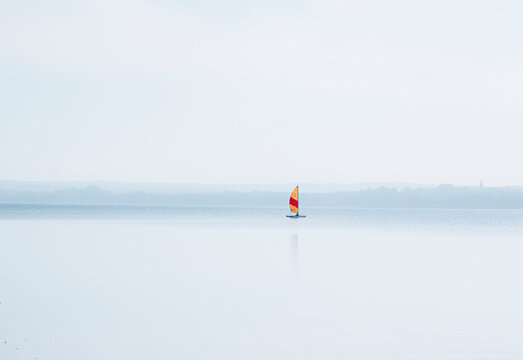 View of small sailing boat on lake Ammersee in Bavaria, Germany.