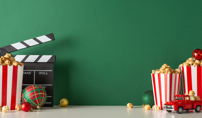 Celebrate Christmas at home with delightful popcorn delivery setup. Capture side view of table with...
