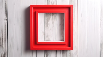 Empty red frame on white wooden background, top view.
