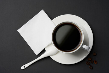 Obraz na płótnie Canvas Black coffee and coffee beans on black background