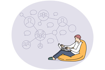 Smiling man work on laptop communicate with colleague on network online. Happy male employee communication with coworkers on computer. Vector illustrations.