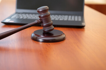 judge's gavel and computer. cyber crimes. the court restricts activities on the Internet.