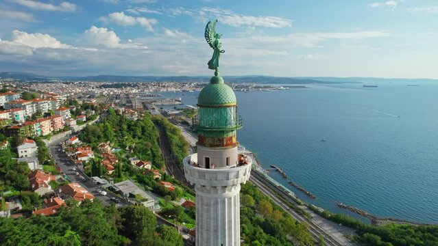 Faro della Vittoria lighthouse in Trieste city at sunny day, Italy