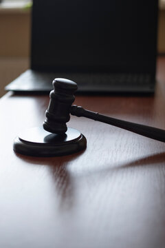 judge's gavel and computer. cyber crimes. the court restricts activities on the Internet.