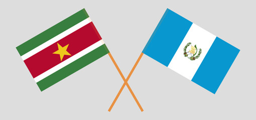 Crossed flags of Suriname and Guatemala. Official colors. Correct proportion