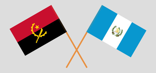 Crossed flags of Angola and Guatemala. Official colors. Correct proportion