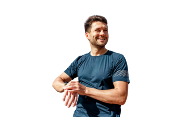 Uses the app to run in a fitness watch on his arm. A man in sports clothes runs does a daily workout in the morning. A sporty person is an active lifestyle concept.