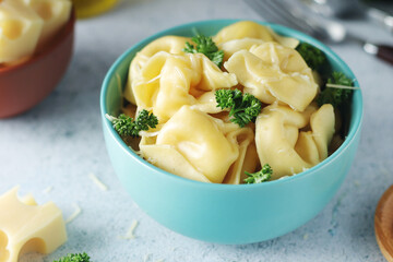 A bowl with Italian dumplings - tortellini