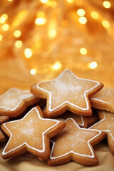 Christmas gingerbread in the shape of stars on a glowing background. New year.