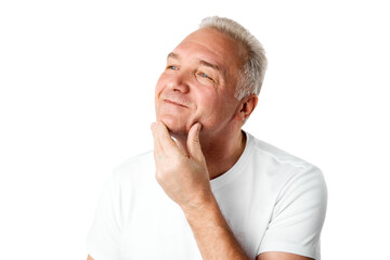 Obraz premium Closeup portrait of smiling man 45s dressed white T-shirt looking away touching his chin isolated over white background