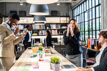 Group of creative business meeting and discussing strategy startup project analysis finance process.Success asian business people work plan and brainstorm marketing idea with laptop in office.Teamwork