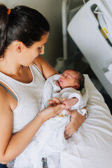 Portrait of an aunt with her one day old nephew