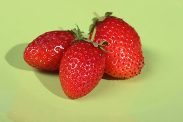 strawberries on a green background
