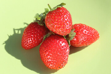 strawberries on a green background