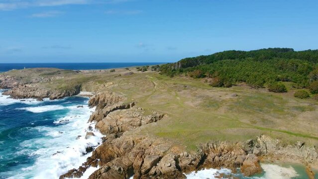 Lonelly Beach, Doni&ntilde;os Beach in Ferrol (Spain) - Landscape and clifts view, closer distance with trees and paths