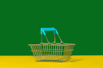 Basket on yellow and green background