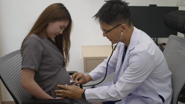 Pregnant woman visit doctor for medical examination. Health care concept.