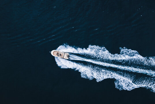 Motorboat floating in dark ocean