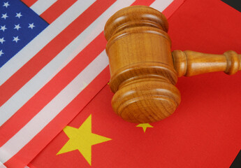 Economy conflict between China and US, tariffs on exports, trade frictions. Flags of USA and China...