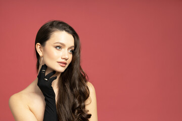 Naklejka premium An attractive girl in a black dress is thinking