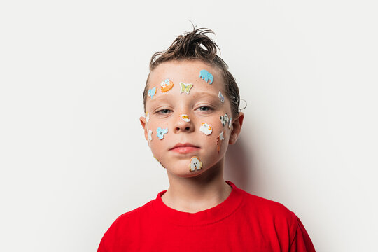 Boy with animal stickers on face