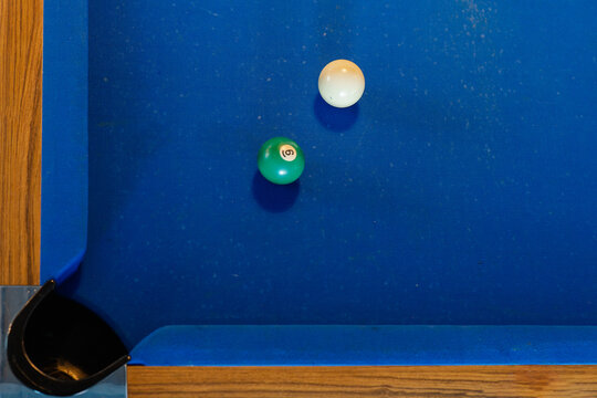 Billiard balls on blue pool table