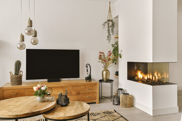 Living room with television and furniture by fireplace