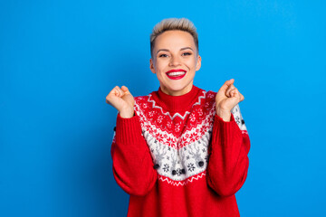 Photo of adorable nice optimistic girl with short hairstyle dressed red sweater clench fists scream...