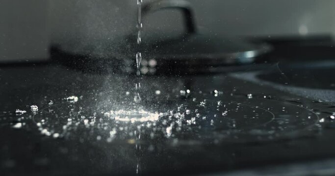 Super Slow-Motion 800 fps Capture of Water Droplets Hitting Hot Stove with High-Speed Camera
