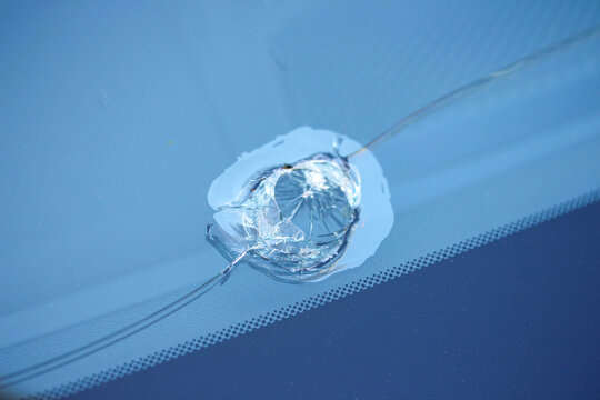 Macro of a big stone chip in a car windscreen