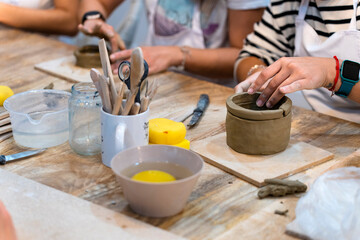 Ceramic Workshop. Middle aged woman working on her new ceramic creation