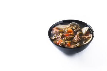 Traditional African okra soup isolated on white background. Copy space