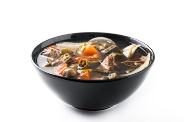 Traditional African okra soup isolated on white background