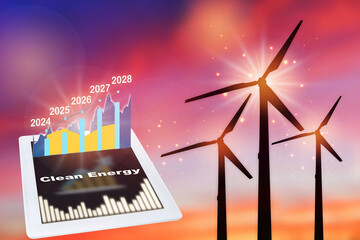 2024 to 2028 growth graph on computer tablet and wind turbine clean energy on sunrise background. Clean energy concept and return investment idea - obrazy, fototapety, plakaty