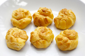 Cream puffs on white background