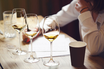 Sommelier degustate wine. Training of restaurant staff, studying alcohol list. Blind wine tasting.