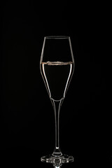 Backlit wine champagne glass with golden liquid