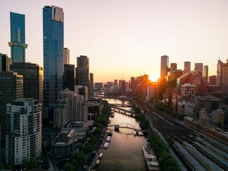 Aerial shot of the cityscape of Melbourne at sunset.