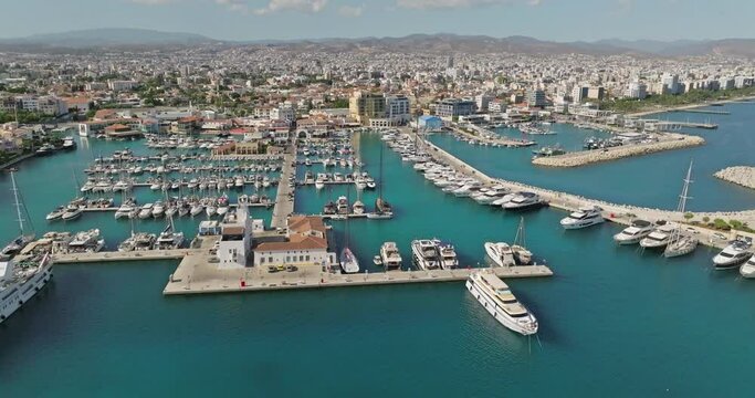Aerial view of the cityscape of Limassol, Cyprus. Marina parking for yachts and boats in a city on an island in the Mediterranean Sea. High quality 4k footage
