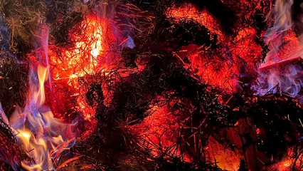 Wandaufkleber Burning hay and wood chips, beautiful color textures © Uros