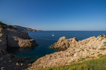 Coast of Mallorca island, Spain, at Cala Rajada, balearic islands, with sailing boat
