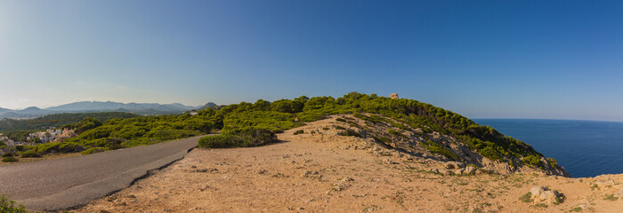 Landscape with road and Mediterranean Sea near Cala Rajada, Spain